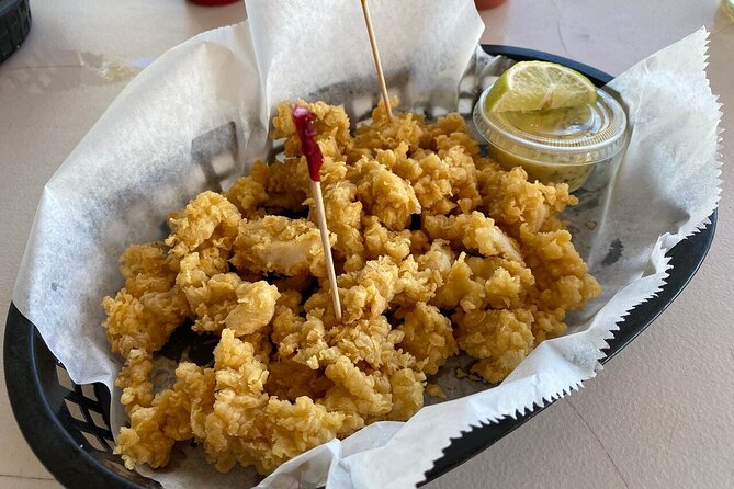Bimini Island Food Taste Experience Tour - Stuart’s Conch Stand Serves a Bahamian Drink by the Beach