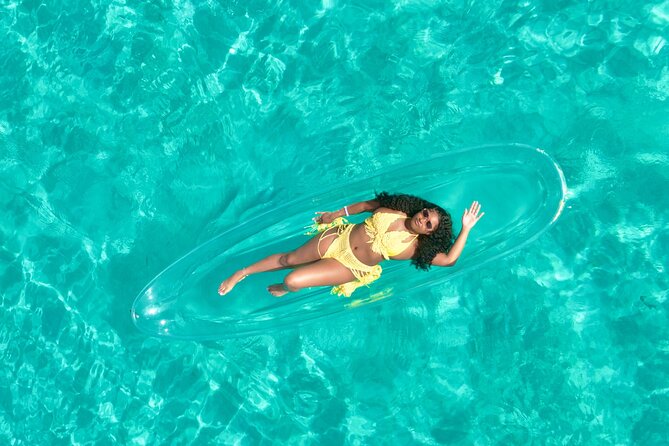 Clear kayak photoshoot Nassau Bahamas. - Making the most of Junkanoo Beach